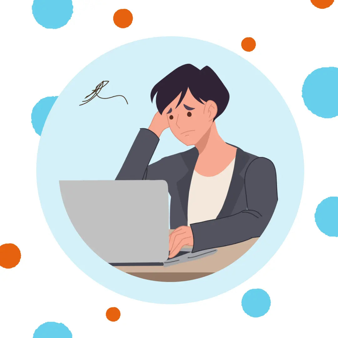 A man looks worried as he looks at his laptop.