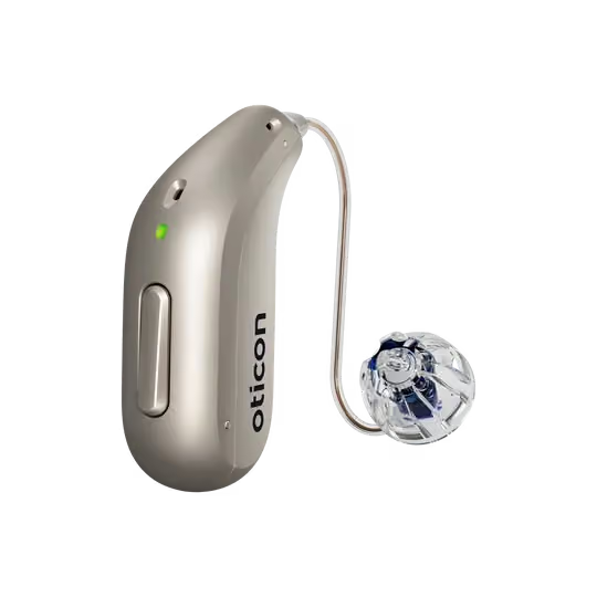 An Oticon Reveal hearing aid stands on a white background. 