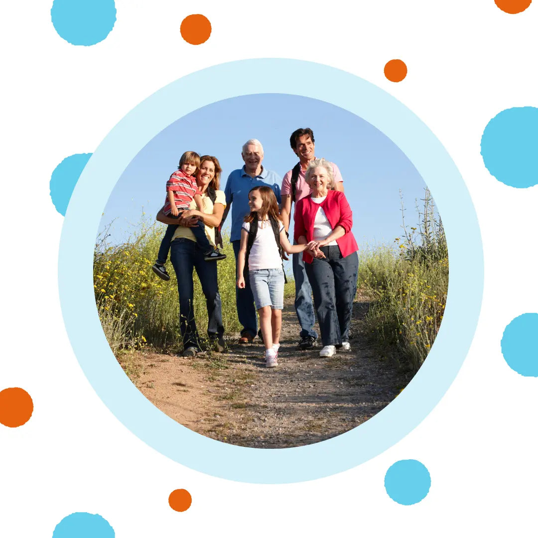 A multigenerational family hikes together.