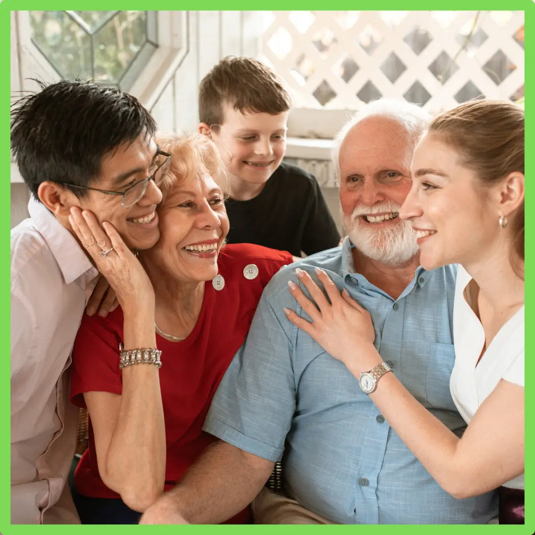Grandparents smile with their 3 grandchildren