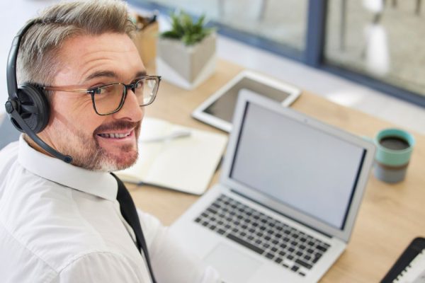 A telesales representative ready to help you know are hearing aids covered by insurance