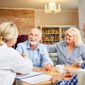 Older people socialize together.