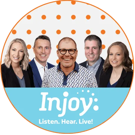 Injoy Hearing team smiling together with 'Injoy' logo and tagline 