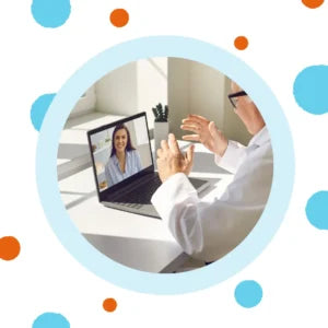 An audiologist talks to a patient online. 