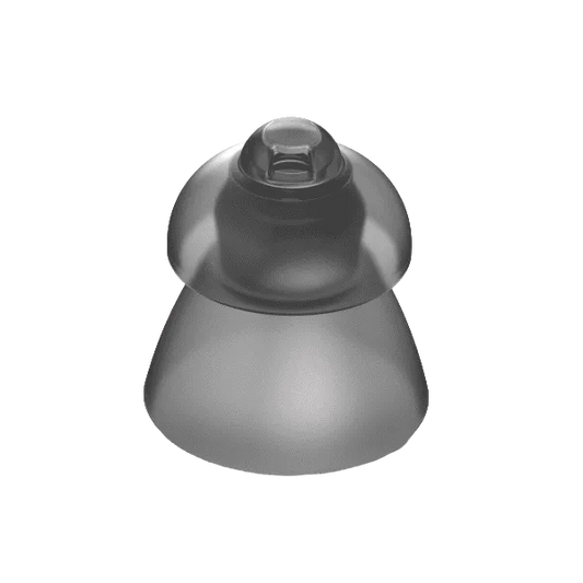 Gray silicone breast implant on a white background