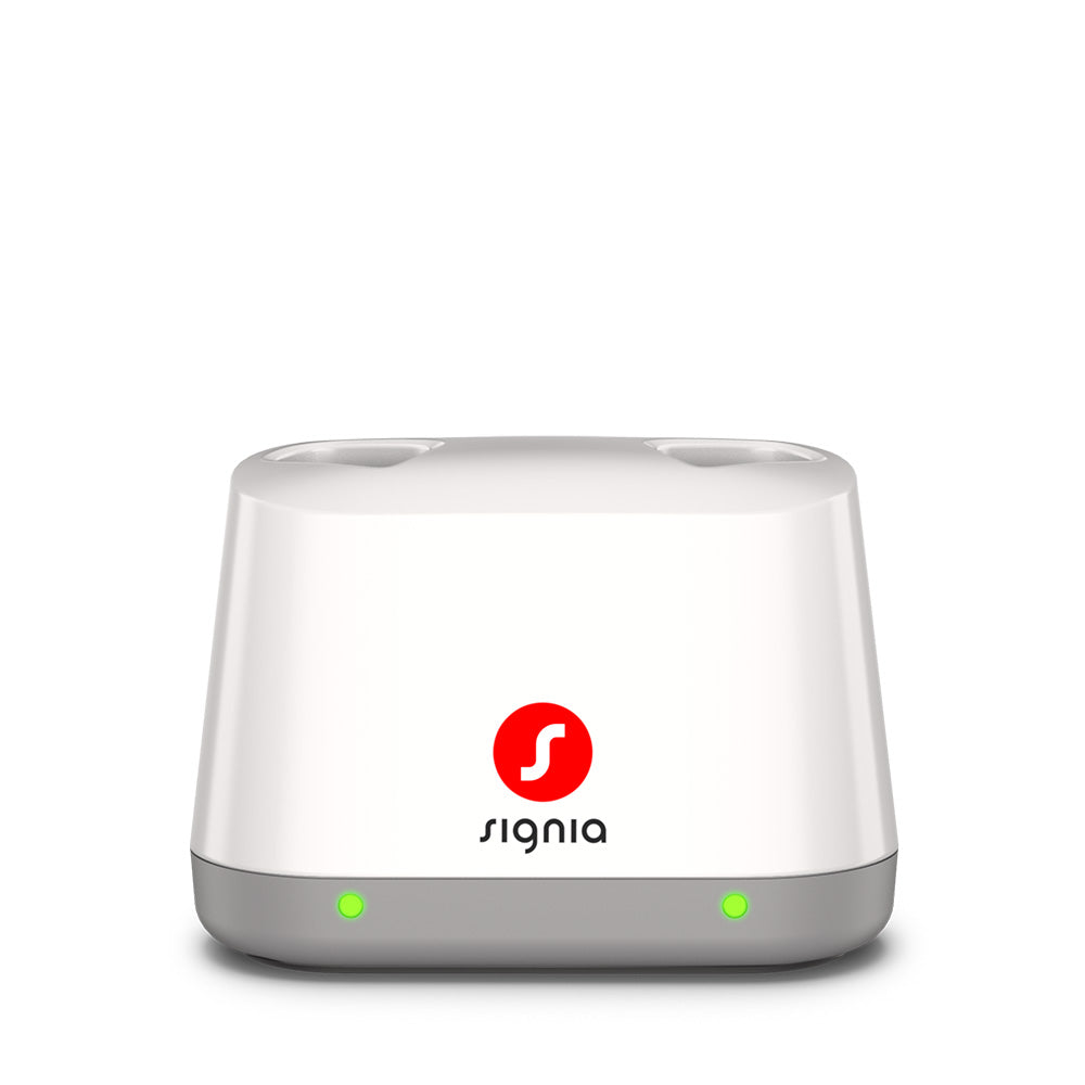 Signia Desktop Charger 2.0 for the Pure Charge&Go MaX, shown empty with its light on.