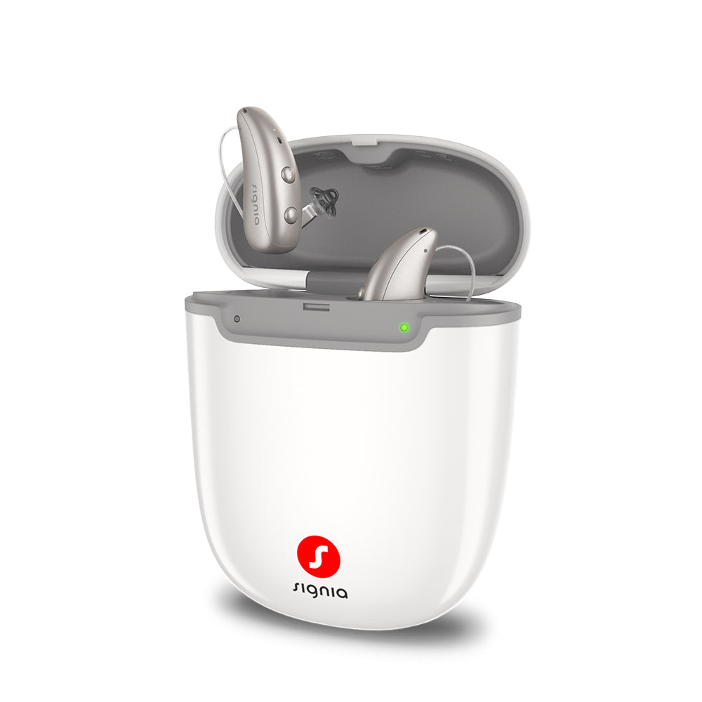 Signia Portable Charger Pure 2.0 open, with a pair of Pure Charge&Go MaX hearing aids seated inside.