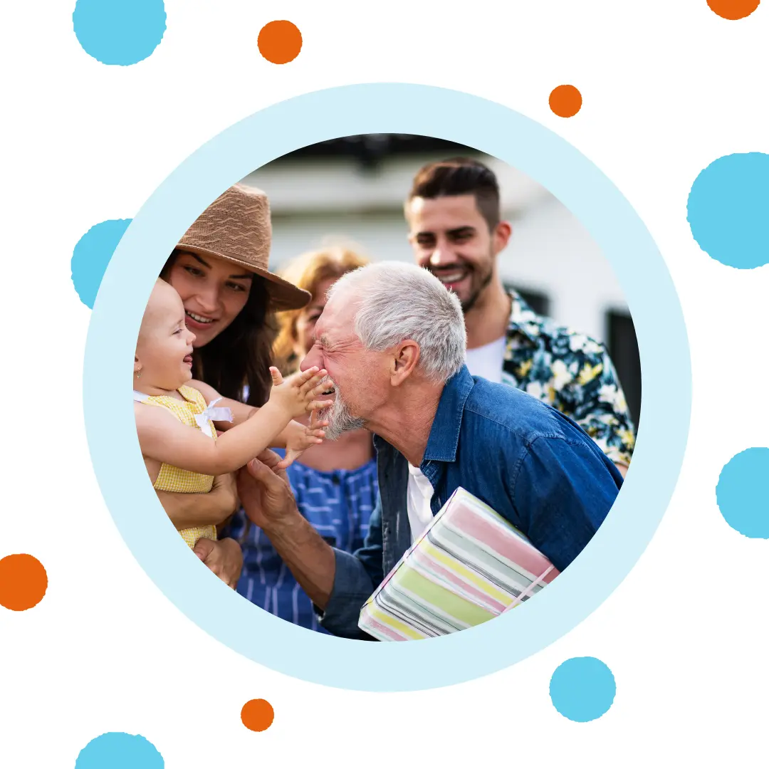 A grandfather talks to his grandchild.