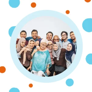 A group of people smiles happily at the camera. 