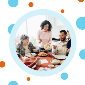 A family sits around a dinner table. 