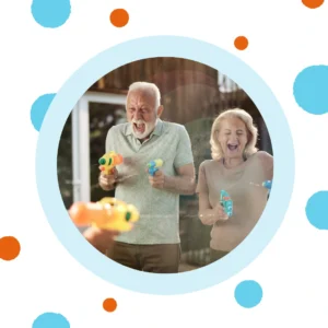 Grandparents join a water fight. 