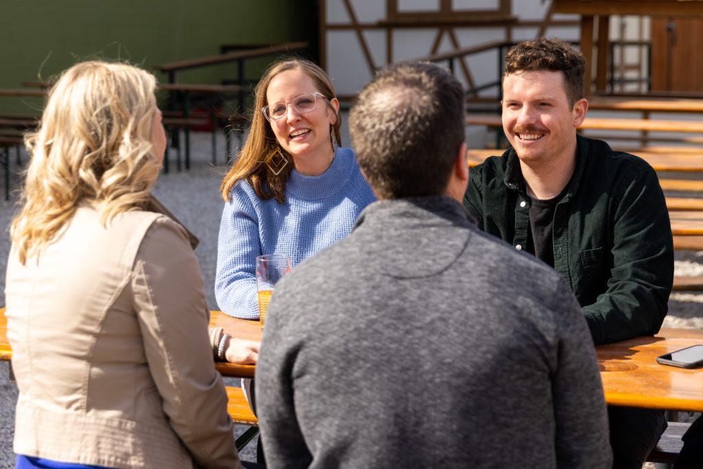 Group of friends outside having lunch