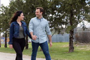 man and woman enjoying a stroll in the park