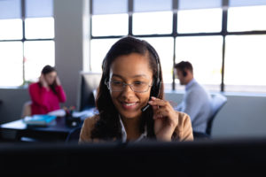 friendly office worker woman taking an order for affordable hearing aids