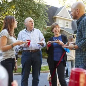 People chatting at a block party.