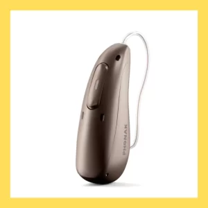 A chestnut-colored Phonak Audeo Sphere Infinio hearing aid stands against a white background.