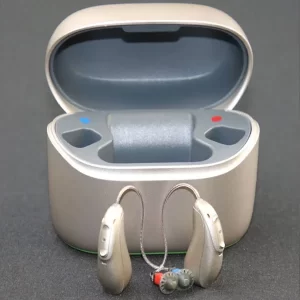 Phonak Audeo Lumity L70-R hearing aids sit in front of their charging case.