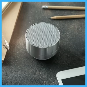 A personal amplifier sits on a table. 