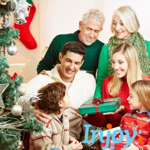 A family exchanges gifts by the tree. 