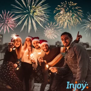 Friends hold sparklers while watching winter fireworks. 