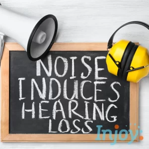 A chalkboard says, "Noise Induces Hearing Loss"