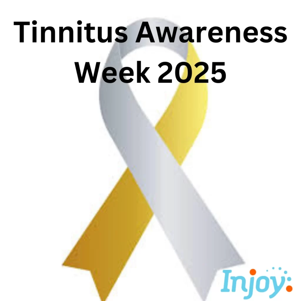 The gold and silver tinnitus awareness ribbon sits on a white background.