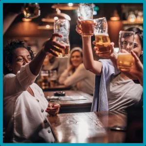 Friends toast at a bar. 