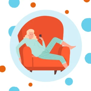A woman relaxes and looks at her phone. 