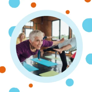 Older people take a yoga class.
