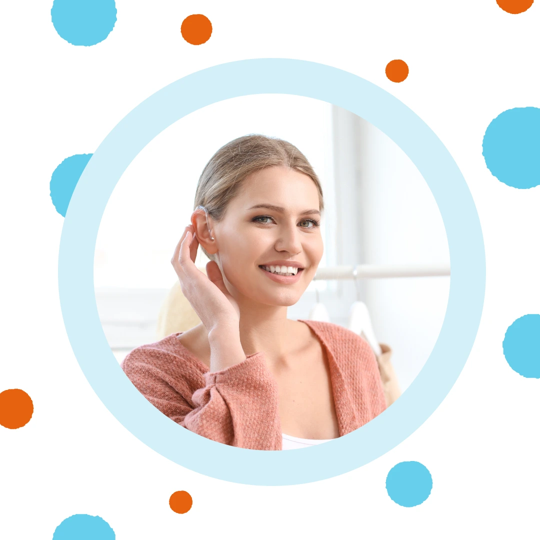 A woman cups her ear to hear better.