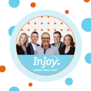 A picture of the Injoy Hearing team sits on a polka-dot background. 