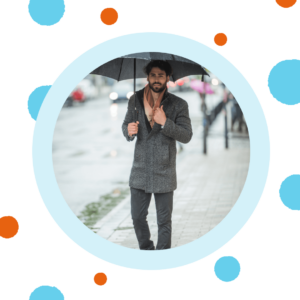 A man walks in the rain. 