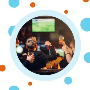 Friends watch sports together at a bar. 