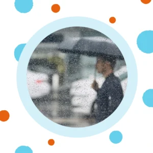 A man hold an umbrella walks in the pouring rain. 