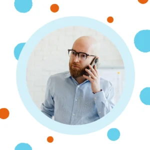 A middle-aged man talks on a cell phone. 