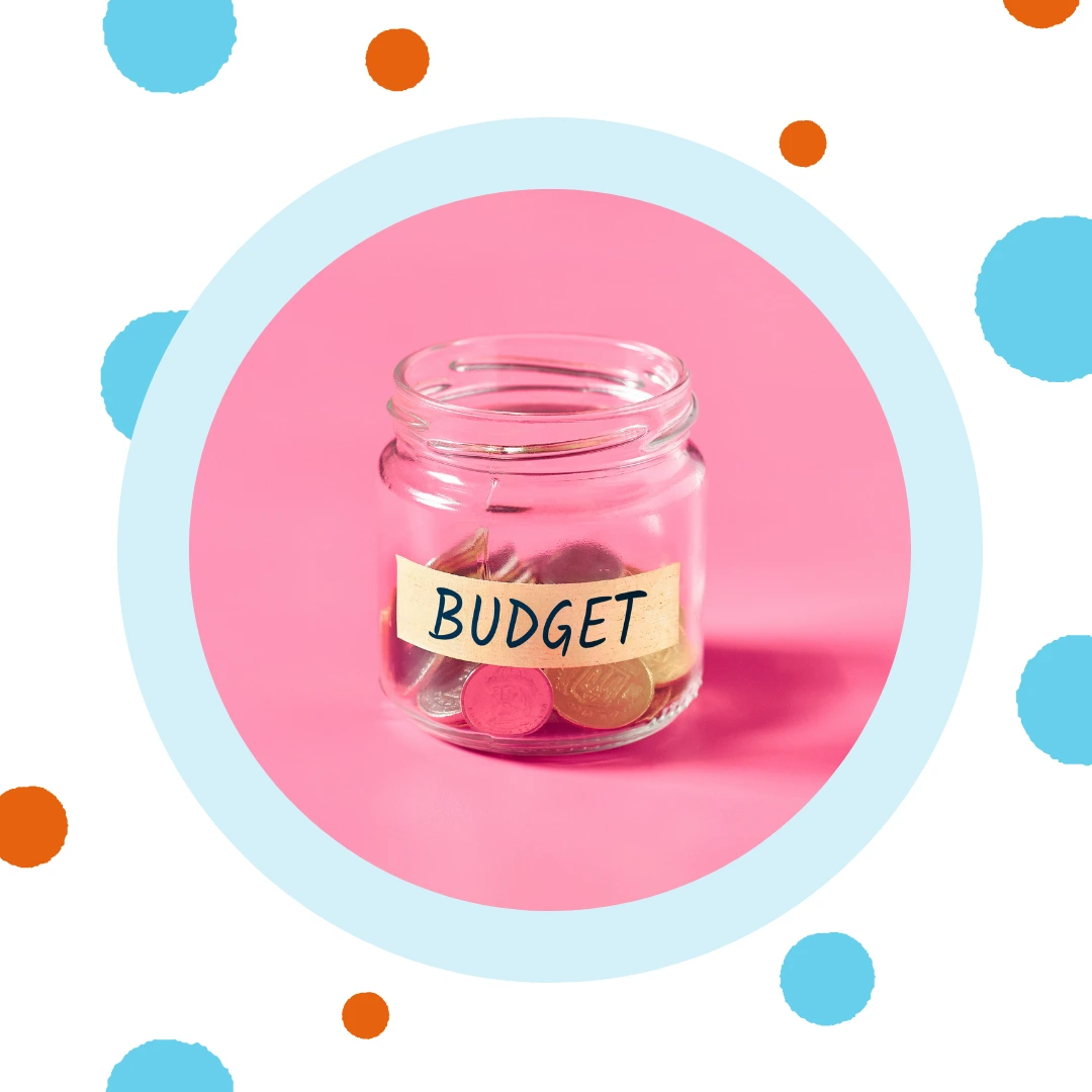 A glass jar has the word "budget" taped across it.