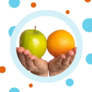 Hands hold an apple and an orange next to each other.