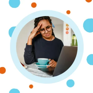 A woman frowns at her computer.