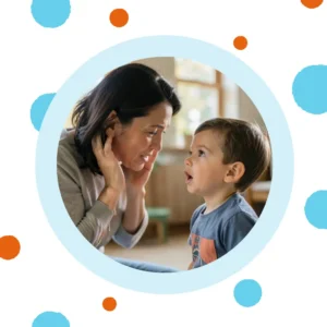 A woman tries to hear what her toddler is saying. 