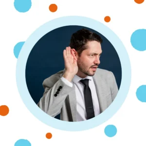 A man holds his hand up to hear better.