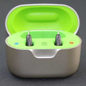 Two Injoy Security hearing aids in charging case