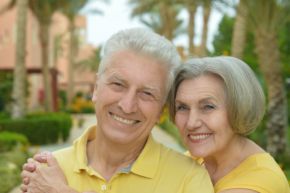 Happy couple with the best hearing aids for seniors