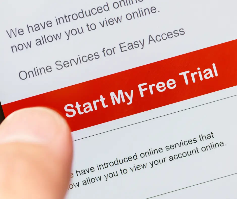 A finger hovers over a screen that says, “Start My Free Trial.” 